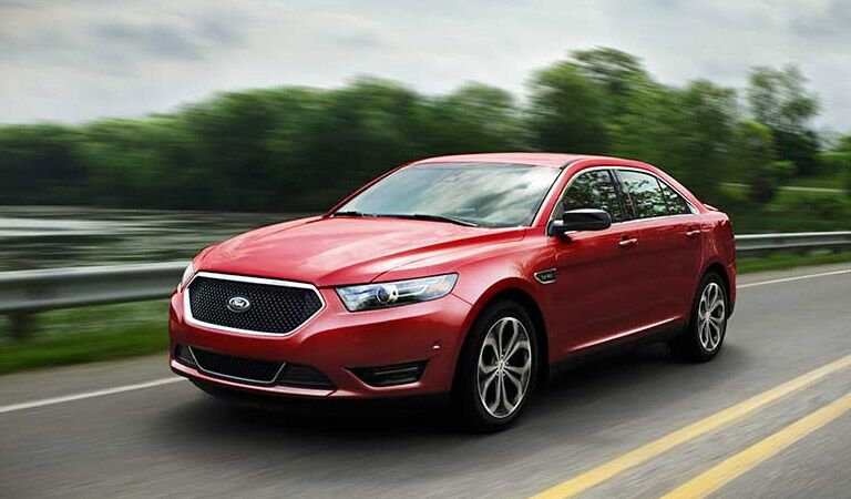 Large Ford Taurus sedan on the road