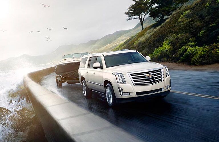 White Cadillac Escalade with Boat