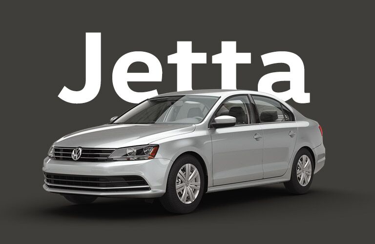 Silver Volkswagen Jetta sits on a black background under large white text that reads, "Jetta."