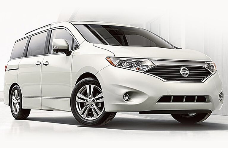 white Nissan Quest in front of white background