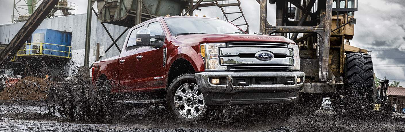 2017 Ford F-250SD driving through mud in construction yard