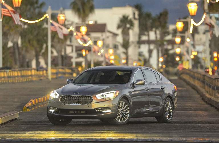 2017 kia k900 parked on boardwalk in front of palm trees