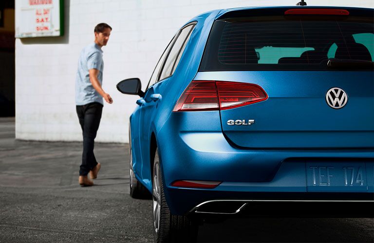 2020 VW Golf blue exterior rear driver side parked man walking away