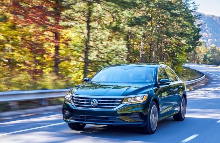 2022 VW Passat in Racing Green passing on a road