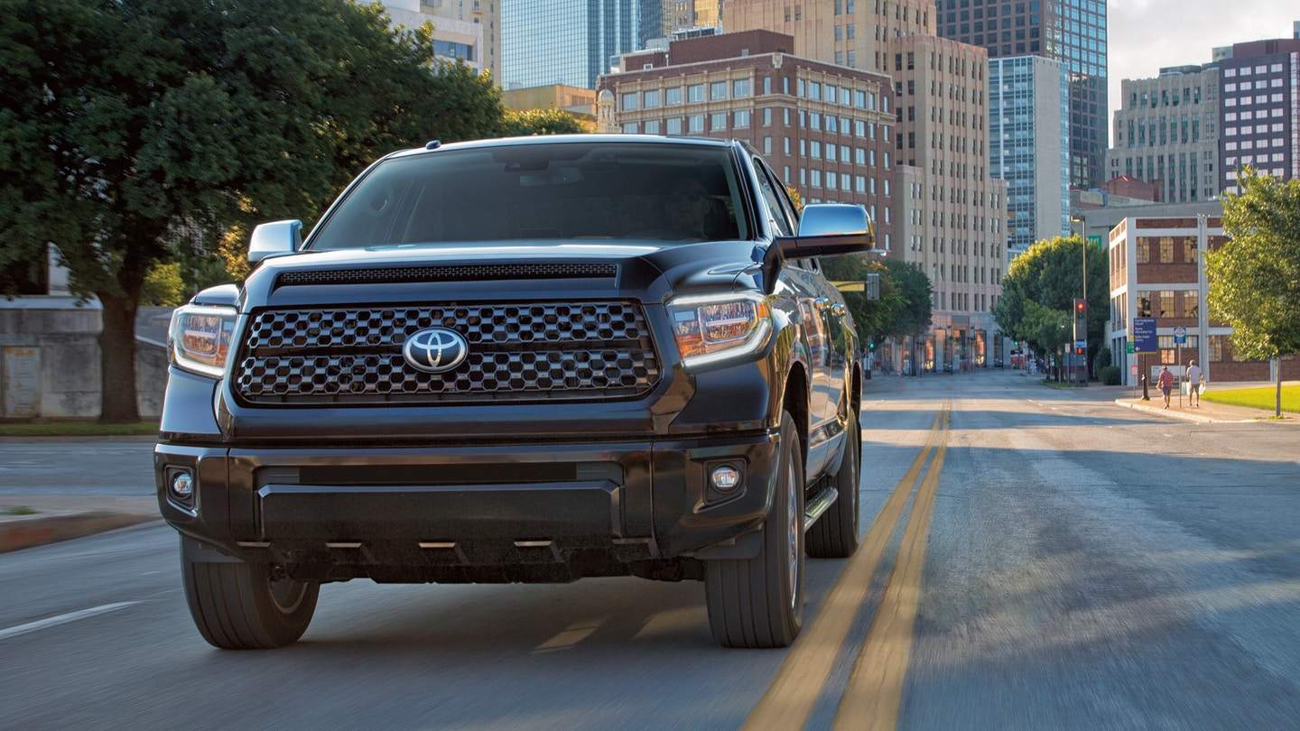 A 2018 Toyota Tundra driving out of the city