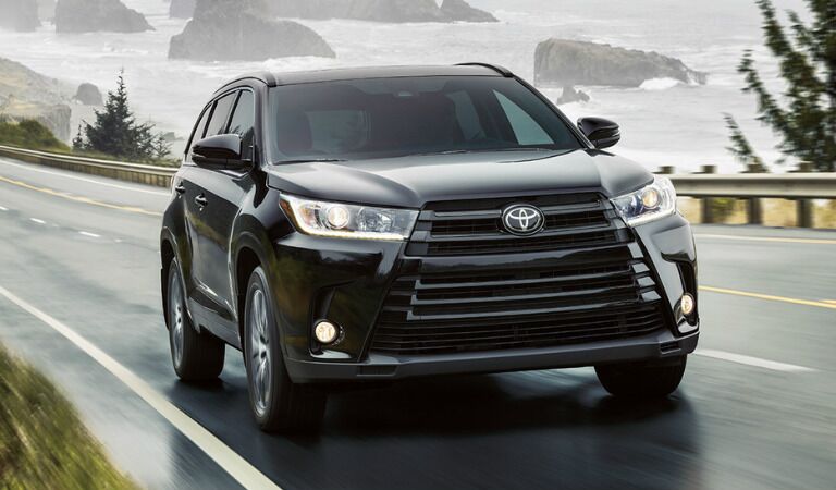 2017 Toyota Highlander driving up incline