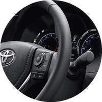 closeup of 2018 Toyota Corolla steering wheel and instrument cluster