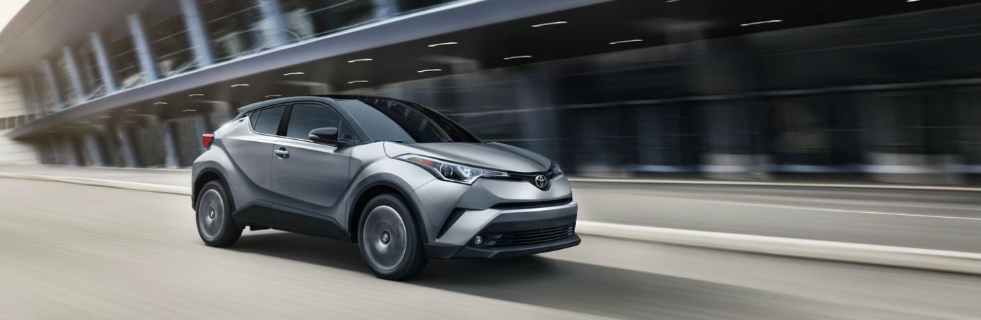 2019 Toyota C-HR exterior front fascia and passenger side going fast on blurred road