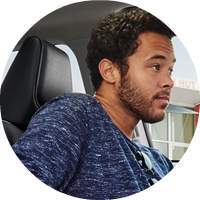 man sitting inside 2018 Toyota Corolla