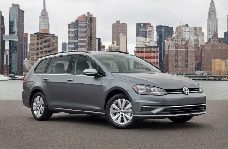 2018 Volkswagen Golf SportWagen parked in front of cityscape