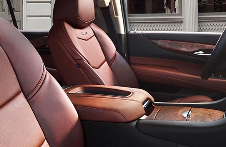 Front seats and center console of 2018 Cadillac Escalade with center console prominent