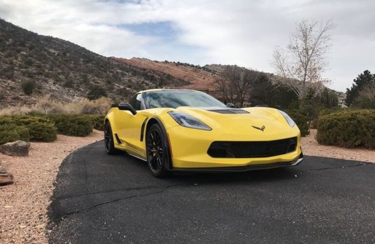 yellow 2016 Chevrolet Corvette parked in desert