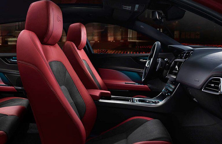 Side View of Red and Black 2018 Jaguar XE Front Seats and Dashboard