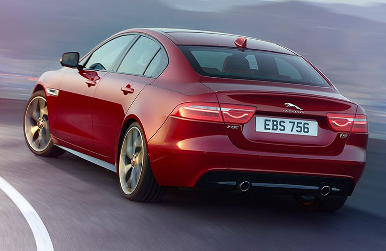 Red 2019 Jaguar XE Rear Exterior on a Freeway