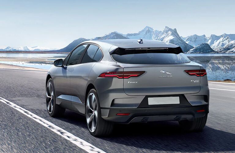 2020 Jaguar I-PACE driving away with mountain in background