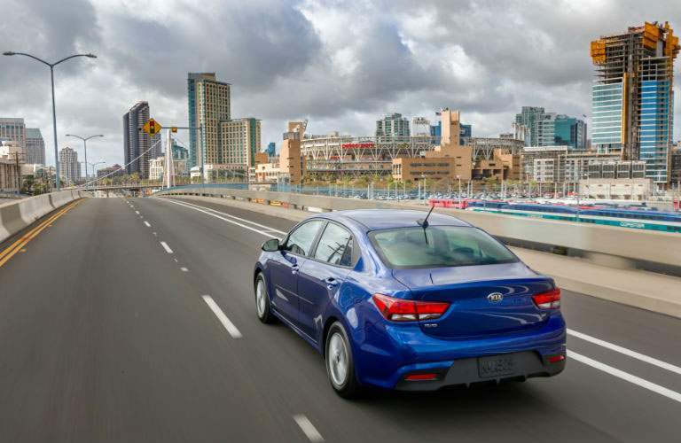 2018 Kia Rio driving down the road