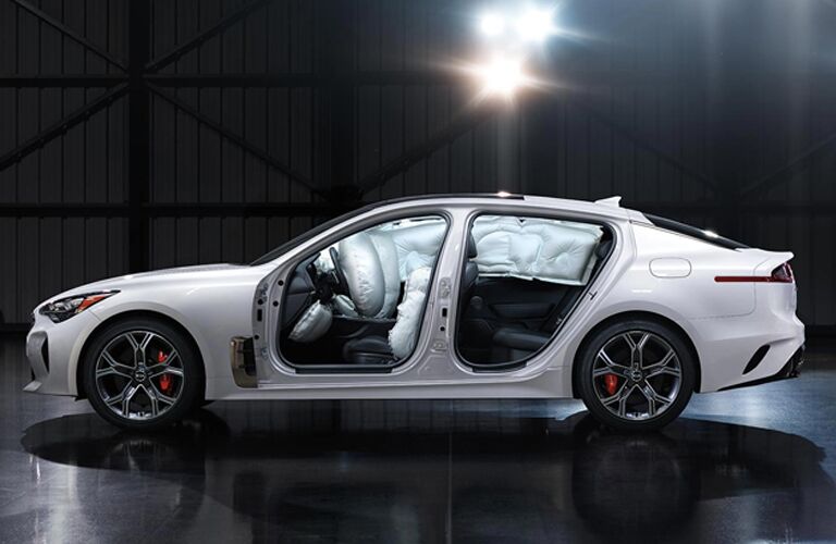 sideview of white kia stinger with airbags deployed, Dayton OH