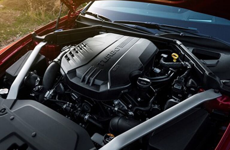 turbo engine under the hood of a red kia stinger, Dayton OH