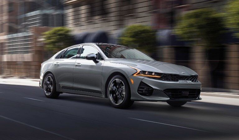 2021 Kia K5 driving down a city street, Dayton OH