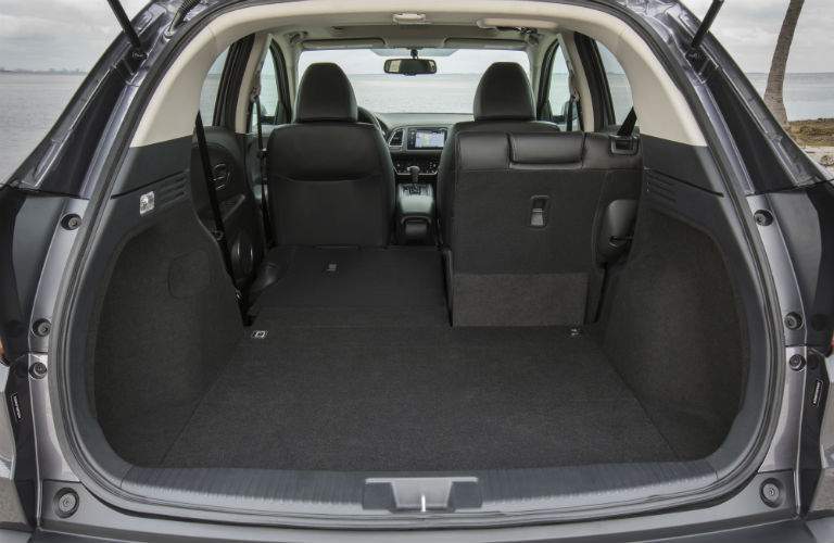 Rear cargo area of the 2018 Honda HR-V with half rear seat folded down