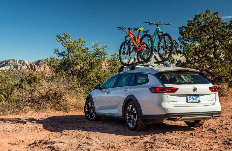 2018 Buick Regal TourX parked with bikes attached to roof rails