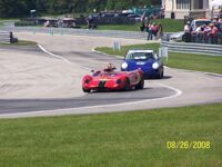 John Weinberger leads a Porsche 911 in his Lotus