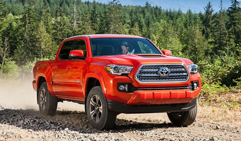 Orange 2016 Toyota Tacoma on the Trail