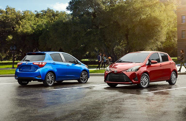 Blue and Red 2018 Toyota Yaris Models in parking Lot