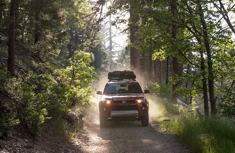 Red 2017 Toyota 4Runner Front on Wooded Trail