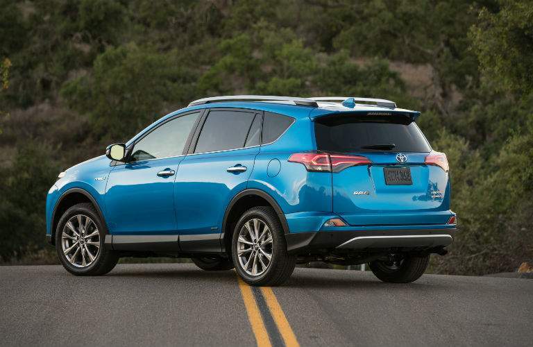Blue 2018 Toyota RAV4 Rear Exterior on Country Highway