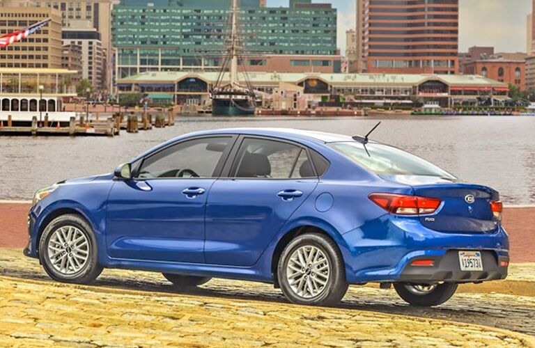 Blue 2020 Kia Rio parked near a marina