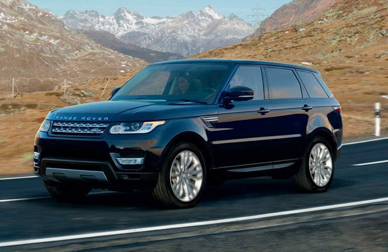 black 2017 Land Rover Range Rover with mountains in the background