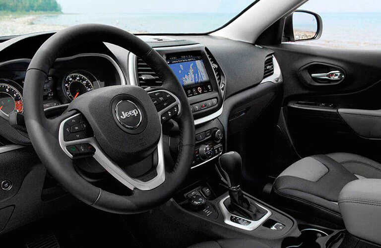 steering wheel and dashboard view 2016 Jeep Cherokee