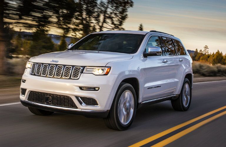white 2017 Jeep Grand Cherokee on the road