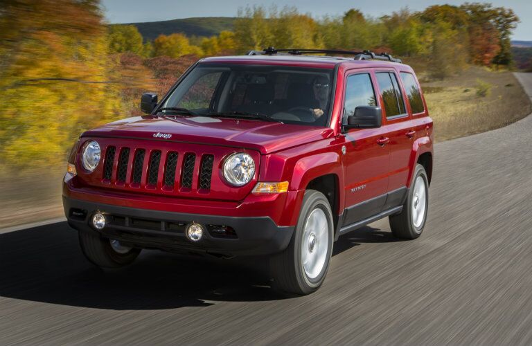 red 2017 Jeep Patriot on the back roads