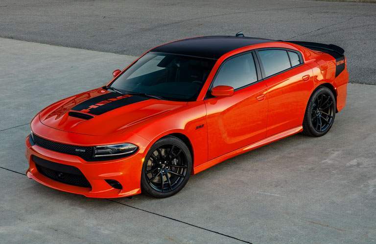 front end of a classy 2018 Dodge Charger with a black hood stripe