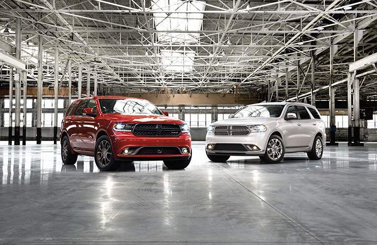 two special editions of the 2018 Dodge Durango parked in a warehouse