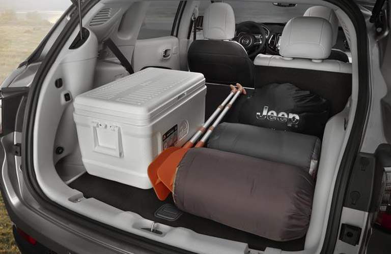 rear cargo area of the 2018 Jeep Compass loaded with camping gear