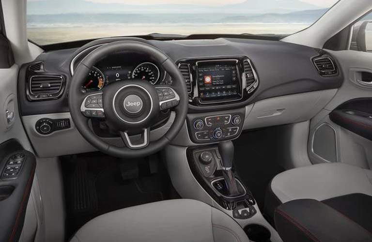 dashboard and Uconnect system in the 2018 Jeep Compass