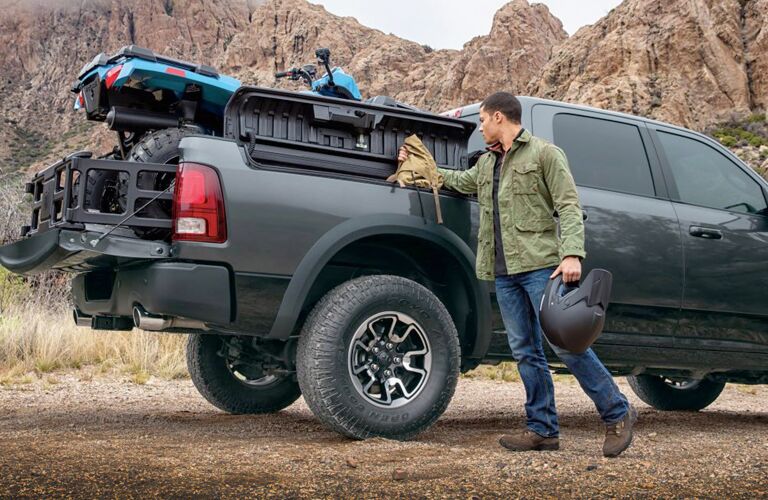 man using the RamBox Cargo Management System on the 2018 Ram 1500