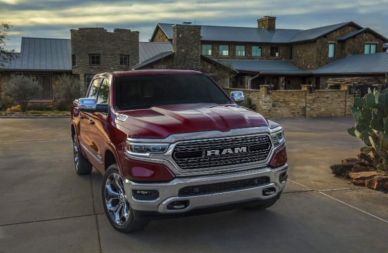 front view of the 2019 Ram 1500 in front of a house