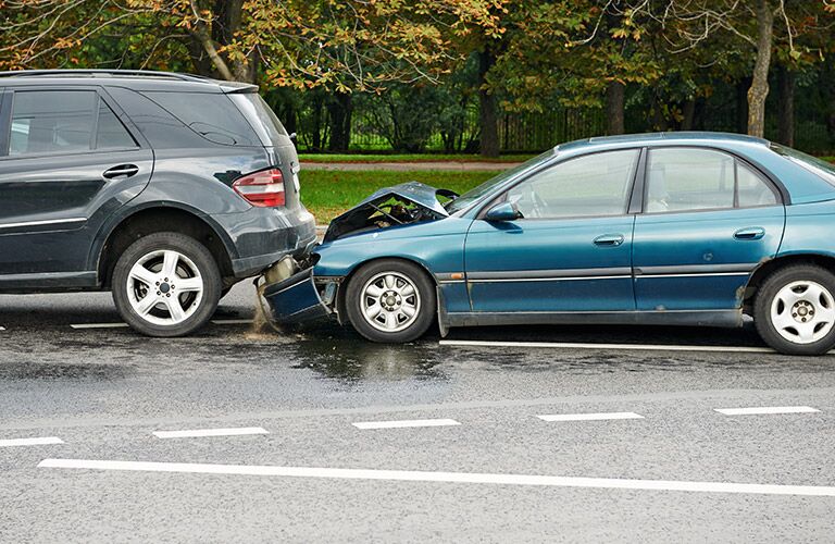 sedan and an SUV in a parking accident
