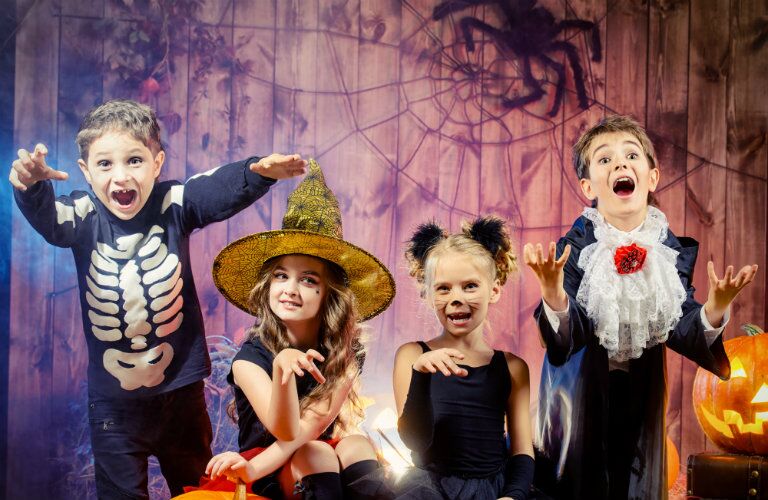 kids in Halloween costumes