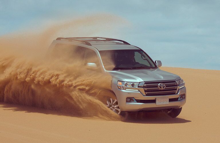 Land Cruiser driving in sand