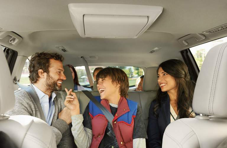 Passengers sitting in the rear seats of the 2018 Toyota Highlander Hybrid