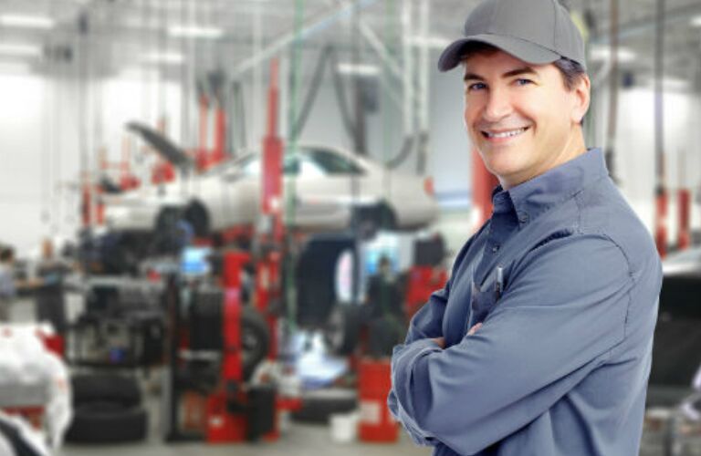 auto mechanic standing in a service center