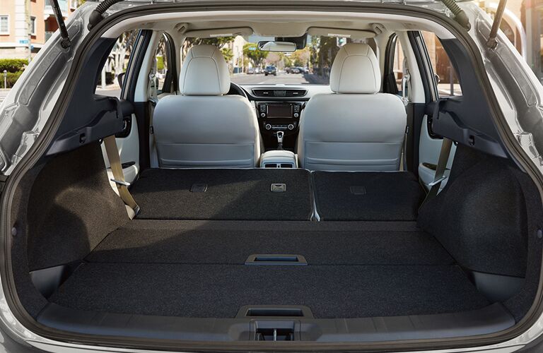 rear cargo space of 2018 nissan rogue sport with rear seats folded down