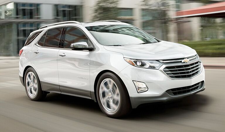 front and side view of white 2018 chevy equinox
