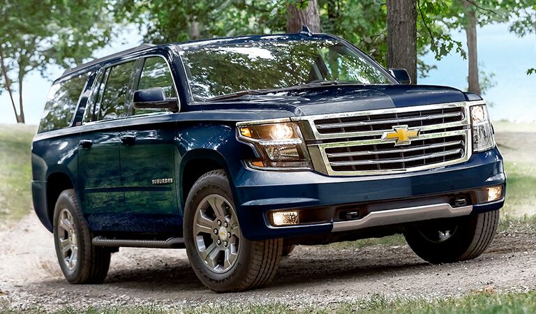 front and side view of blue 2018 chevrolet suburban