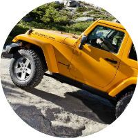 This yellow Jeep Wrangler Rubicon can crawl on rocky terrain.